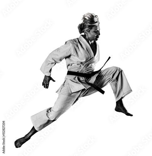 Martial arts concept. Young sporty woman in kimono on white background