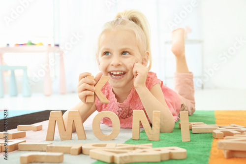 Cute little girl and word M...
