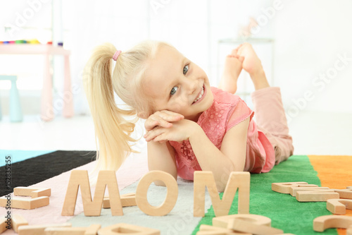 Cute little girl and word M...