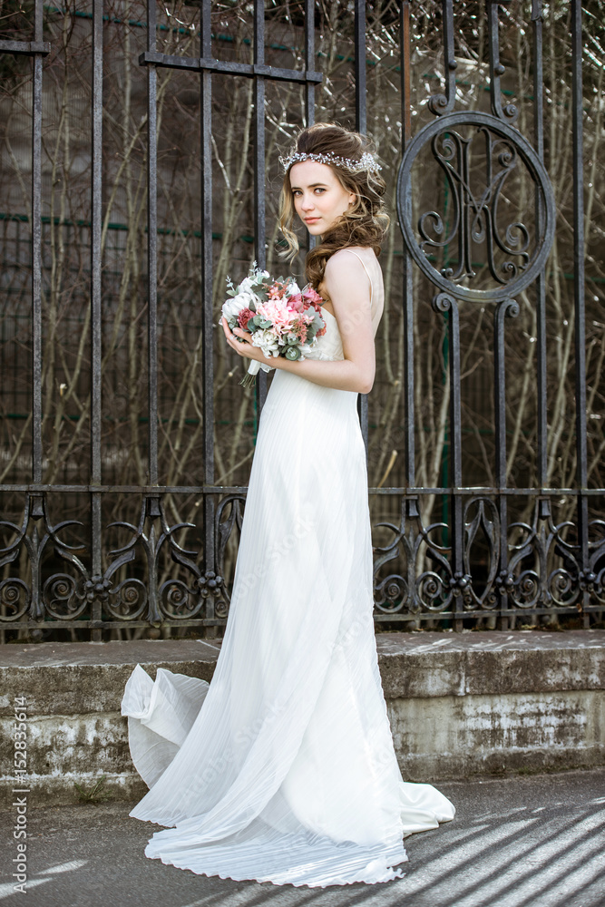 Brunette bride in fashion white wedding dress with makeup Brunette bride in fashion white wedding dress with makeup