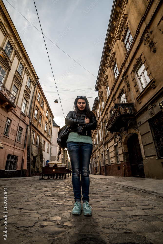 woman walking by old europian city