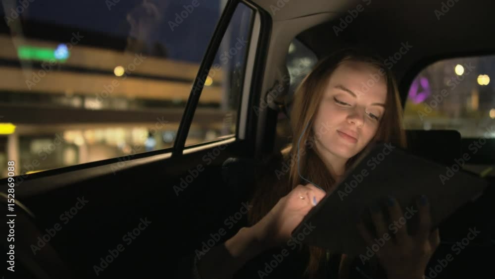 Woman Looking Through the Window and Smiling Slightly Woman Looking Through the Window and Smiling Slightly