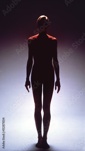 Female silhouette top lit red