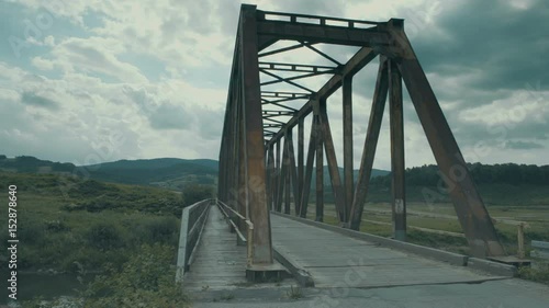 An old steel and wooden bridge in Poland.  photo