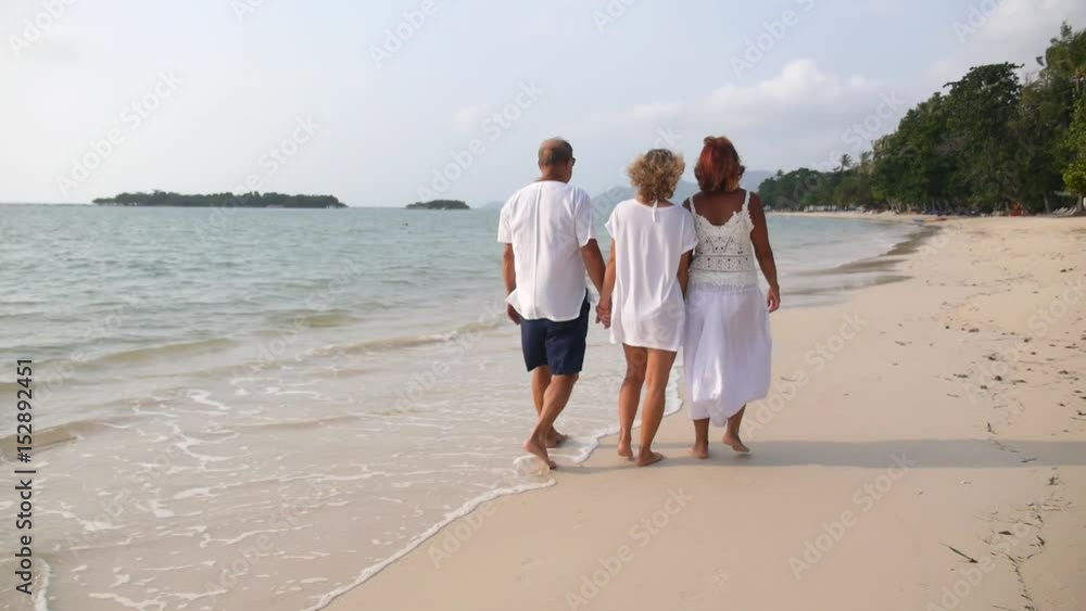 Happy Family Walking on Beach on Holidays. Slow Motion. HD, 1920x1080. Happy Family Walking on Beach on Holidays. Slow Motion. HD, 1920x1080.