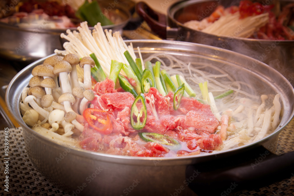 Korean hot pot of beef with mushroom, onion and chili