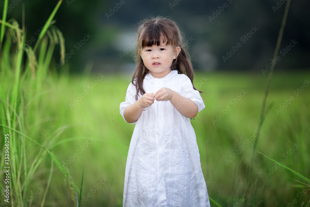 Happy cute little girl outdoors in summer day Happy cute little girl outdoors in summer day