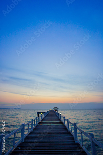 Fototapeta Naklejka Na Ścianę i Meble -  The wooden bridge on sea at sunset, Thailand.