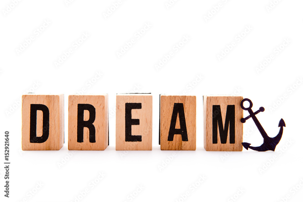 Dream Boat - wooden block letters and anchor icon on white background
Dream Boat - wooden block letters and anchor icon on white background