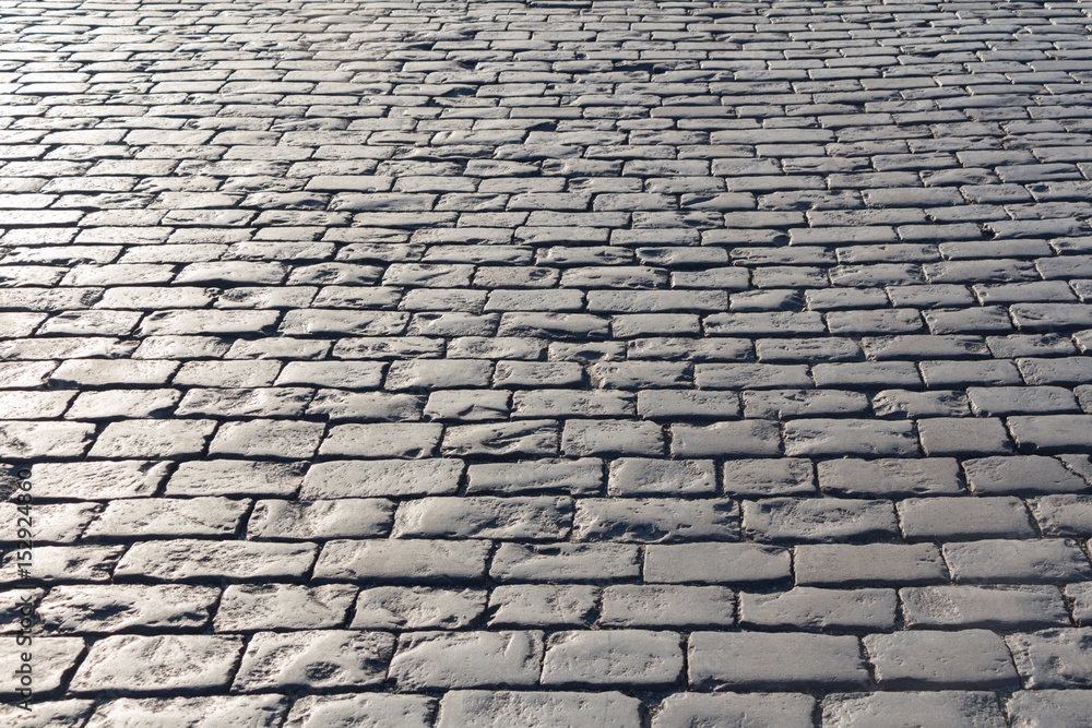 Pavement background in sunny day, cobblestone, Red Square, Moscow
