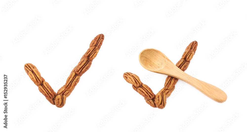 Yes tick made of pecan nuts isolated Yes tick made of pecan nuts isolated