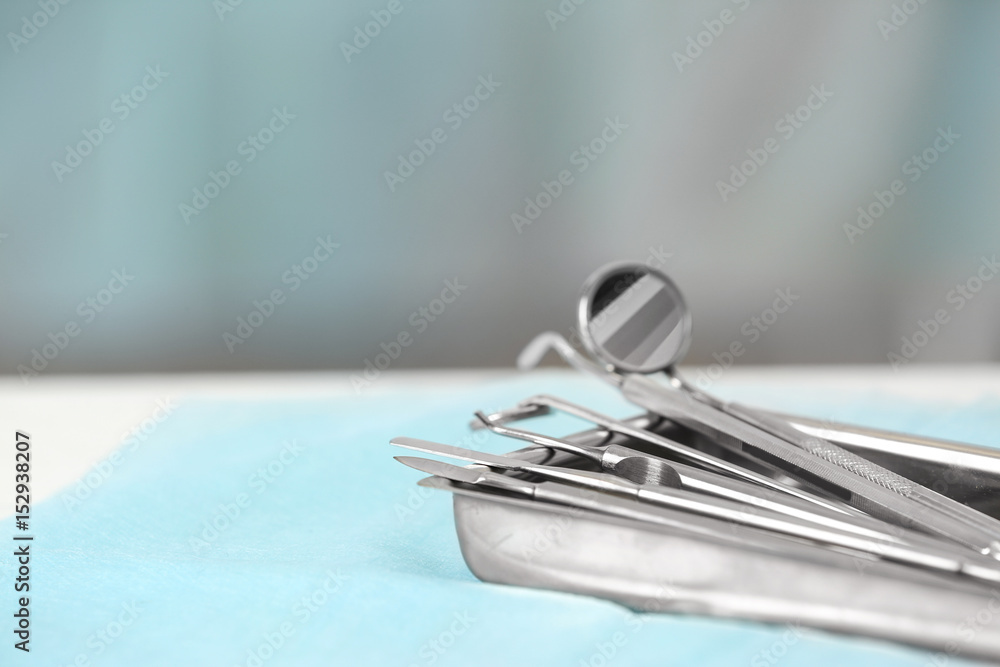 Dental tools in medical basin on table, closeup Dental tools in medical basin on table, closeup