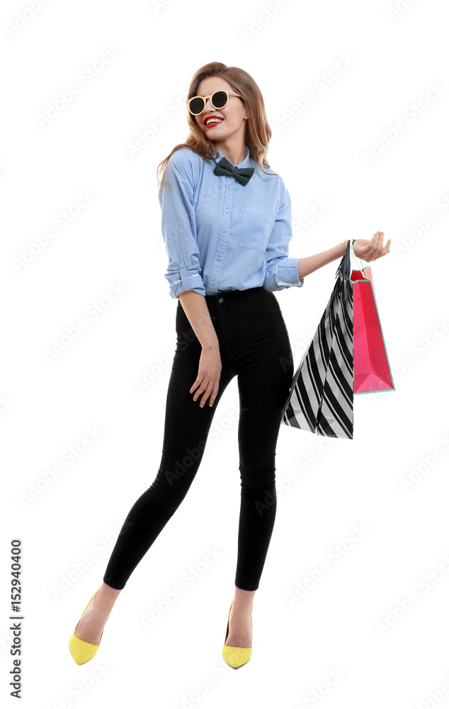 Beautiful young woman with paper bags on white background Beautiful young woman with paper bags on white background