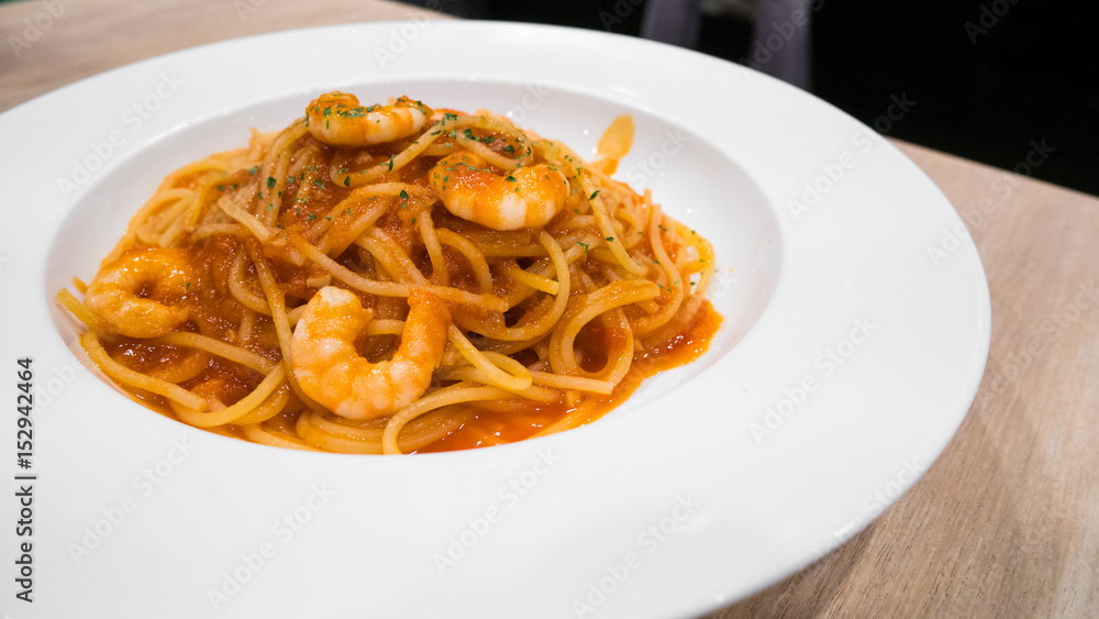 Spaghetti shrimp sauce in modern italian restaurant.