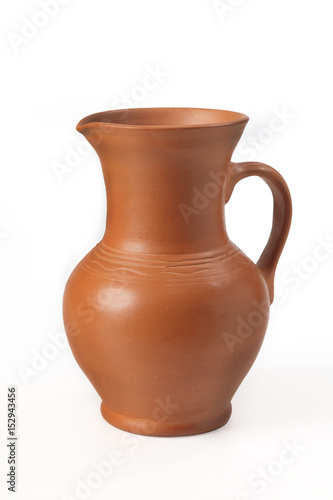 Pitcher ceramic (handmade) with handle. Isolated on white background