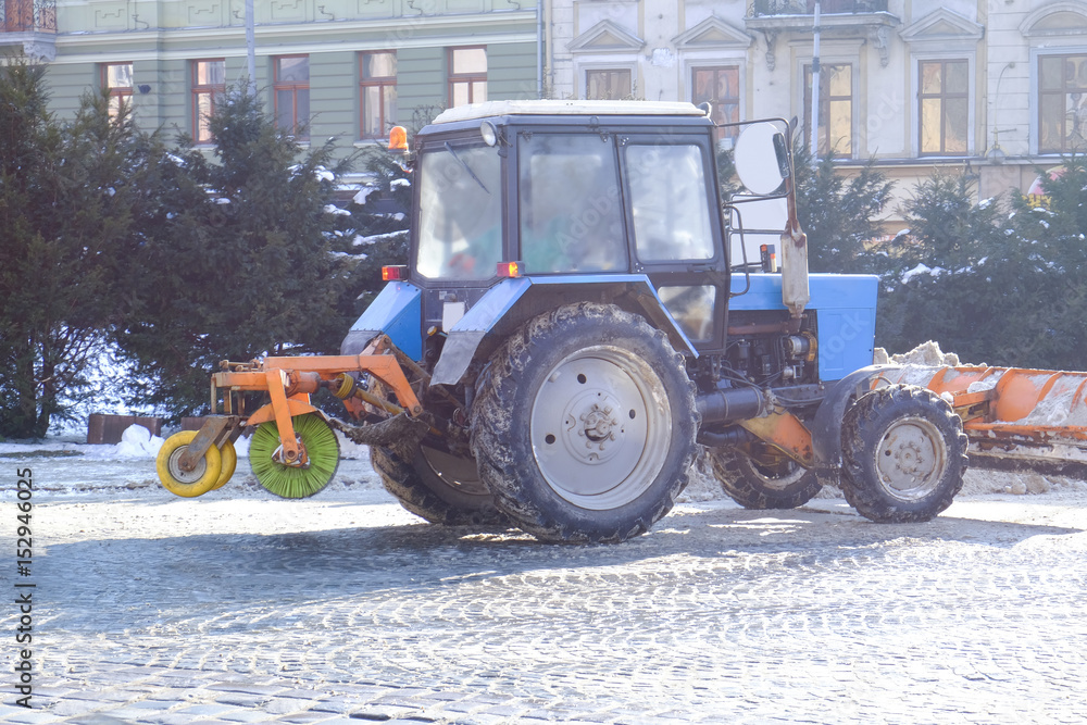 Snow plow at work on city street