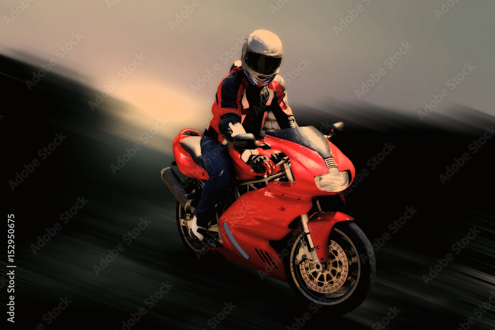 motorcyclist on a sport bike in motion.