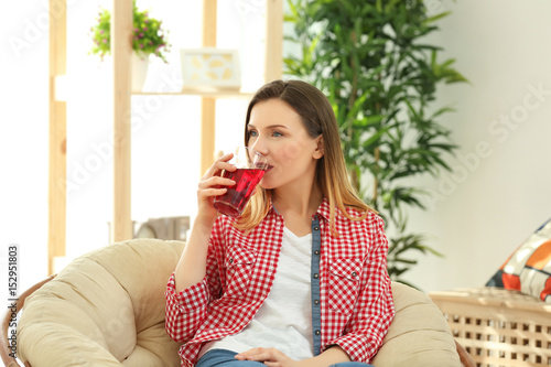 Beautiful woman drinking fr...