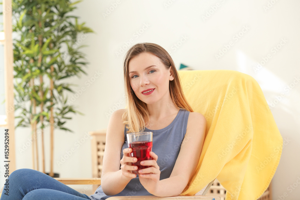 Beautiful woman with glass of fresh juice at home Beautiful woman with glass of fresh juice at home