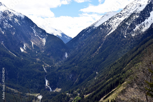 Beautiful alpine landscape from Gerlos Pass, Austria. Snow-capped montains, Krimml Waterfalls and valley.