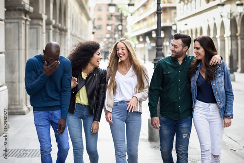 Group of friends having fun together outdoors