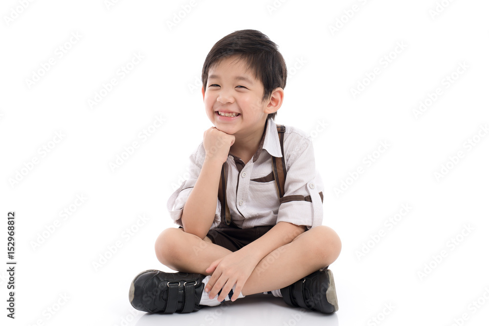 Happy asian boy sitting on white background Happy asian boy sitting on white background