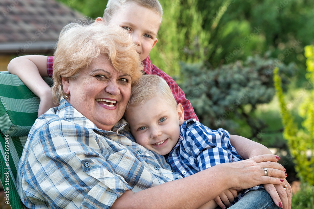 Family portrait.Beautiful grandma and her two beloved grandchildren. Family portrait.Beautiful grandma and her two beloved grandchildren.