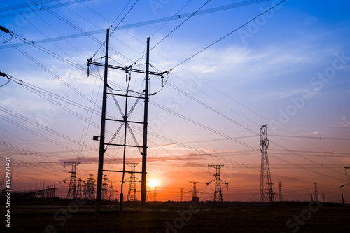 The silhouette of high voltage towers