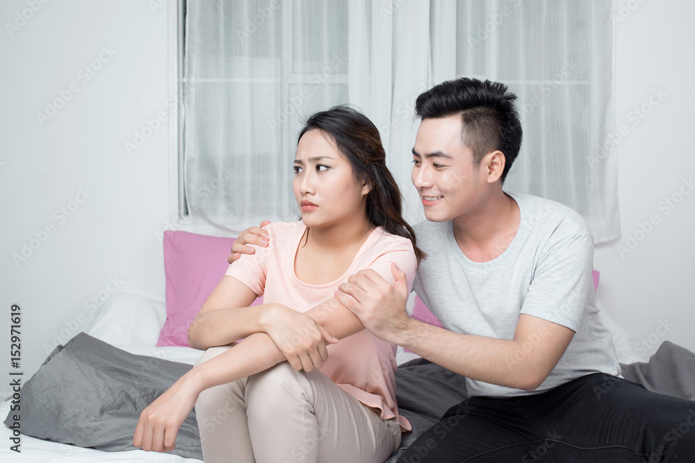 Young asian couple mad at each other in their home Young asian couple mad at each other in their home