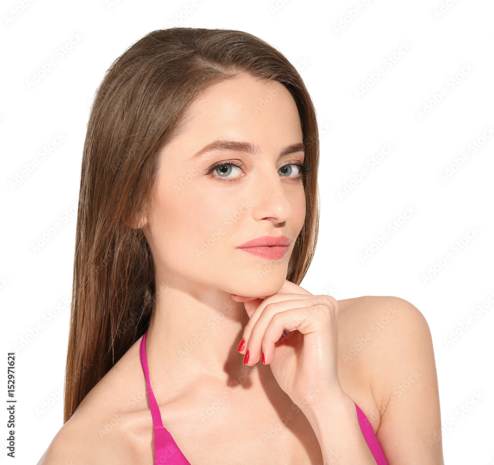 Beautiful young woman in swimsuit on white background