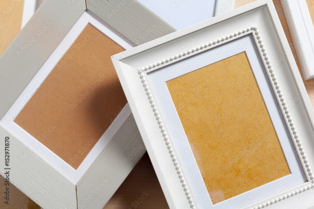 Fototapeta premium Blank photo frame on the table