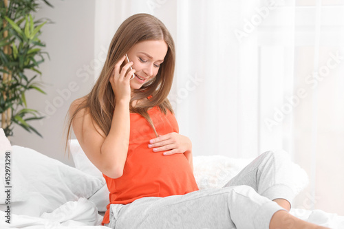 Emotional pregnant woman ta...