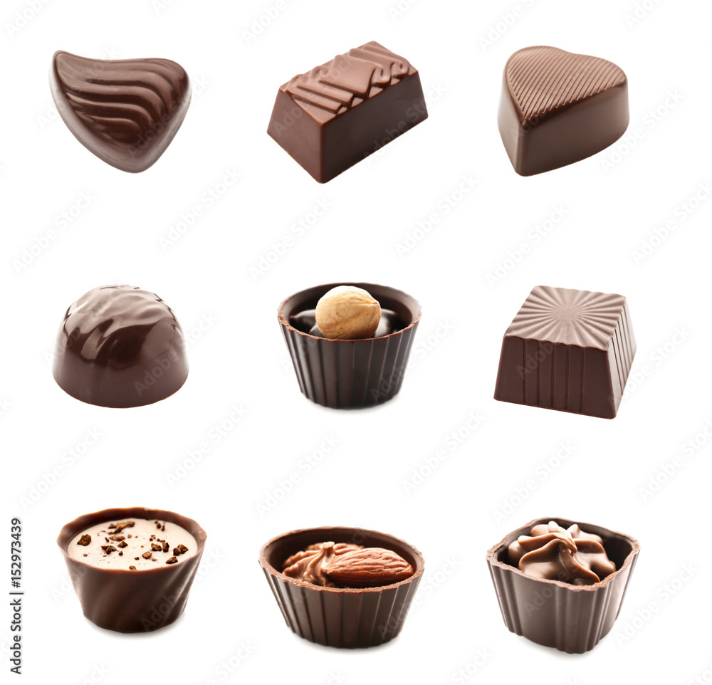 Set of delicious chocolate candies on white background