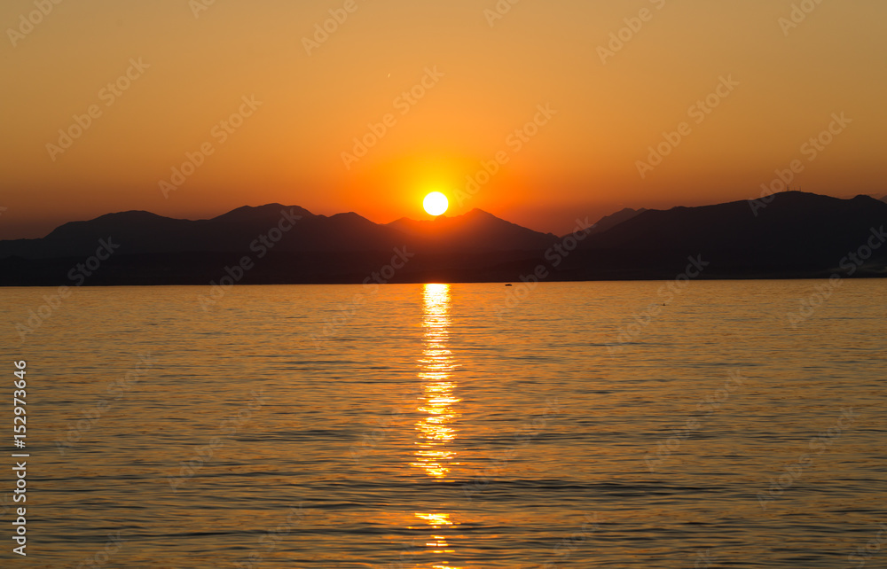 Fototapeta premium Beautiful sunset at Garda lake in Italy