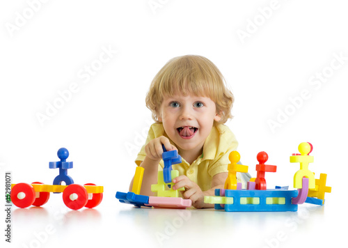 Little cute boy playing wit...