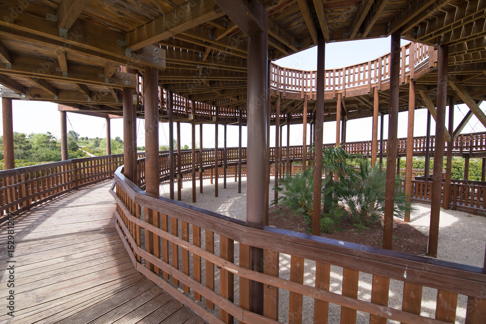 rise circular ramp of wooden lookout tower, with columns and interior garden, in public park named Felipe VI or Forest Park Valdebebas, in Madrid city, Spain
rise circular ramp of wooden lookout tower, with columns and interior garden, in public park named Felipe VI or Forest Park Valdebebas, in Madrid city, Spain