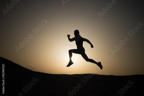 running man on mountain nature landscape on sky background