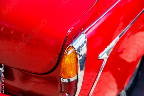 Photography Headlights of a classic or retro car in a car shop
