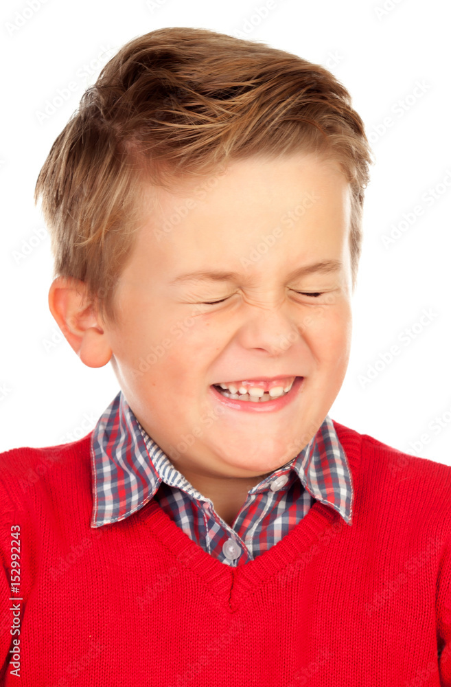 Blond child with a funny expression closing his eyes Blond child with a funny expression closing his eyes