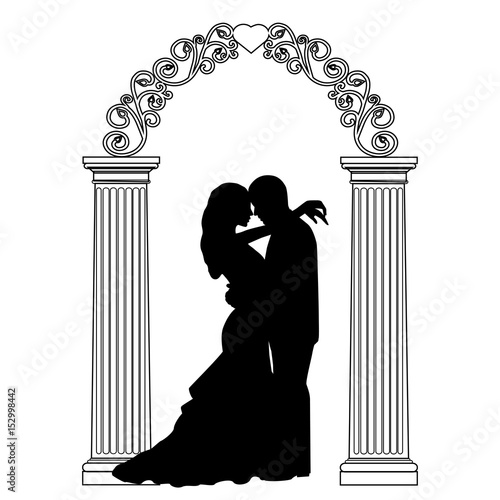 Wedding arch with bride and groom.