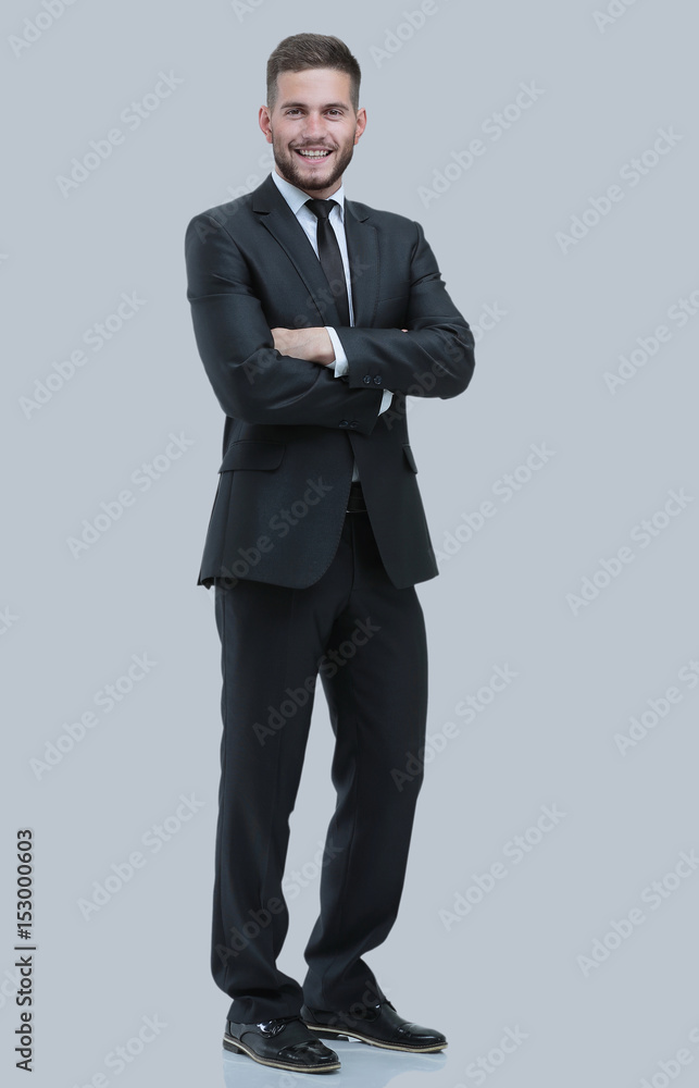 Portrait of a smiling business man. Isolated on gray Portrait of a smiling business man. Isolated on gray