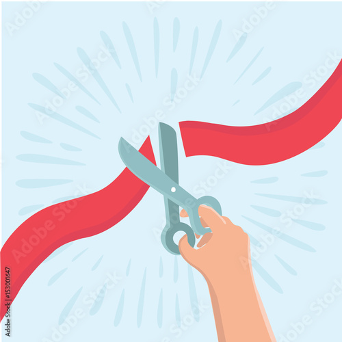 Hand holding scissors and cutting red ribbon