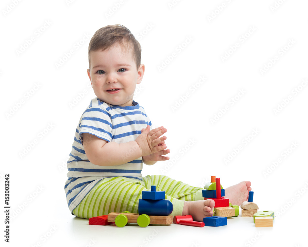 Baby boy playing with blocks toys. Isolated on white. Baby boy playing with blocks toys. Isolated on white.