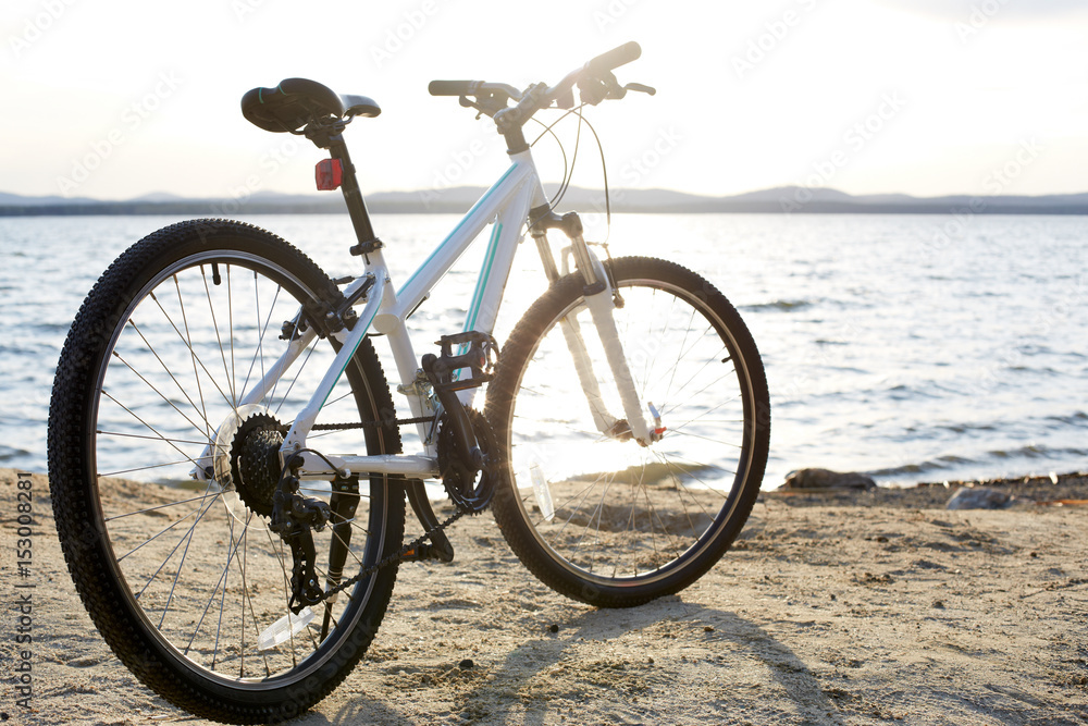Bicycle in nature landscape. A bicycle stands alone by the lake Bicycle in nature landscape. A bicycle stands alone by the lake