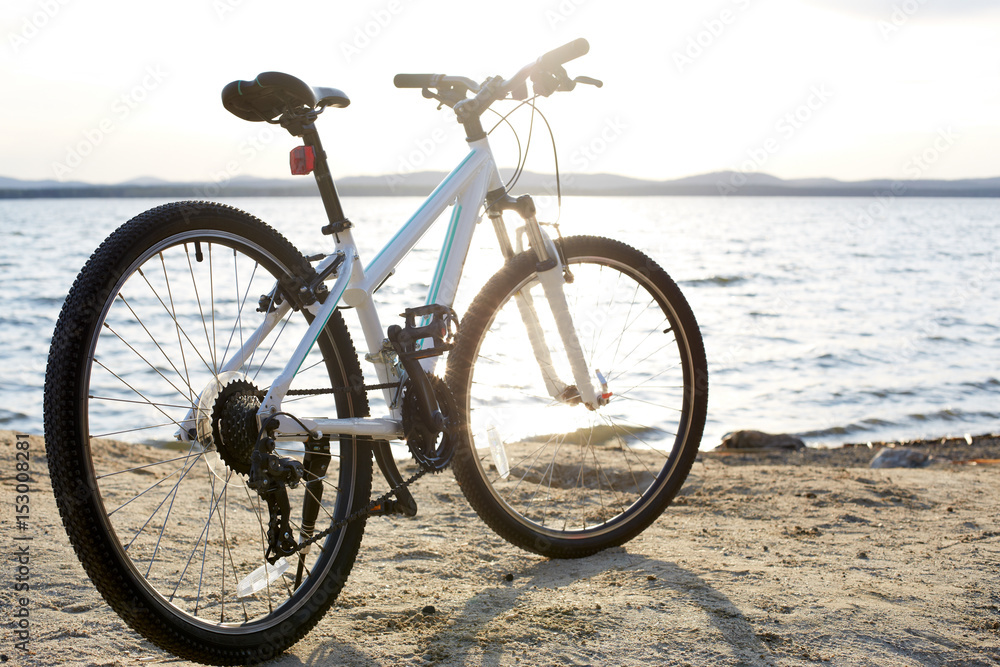 Bicycle in nature landscape. A bicycle stands alone by the lake