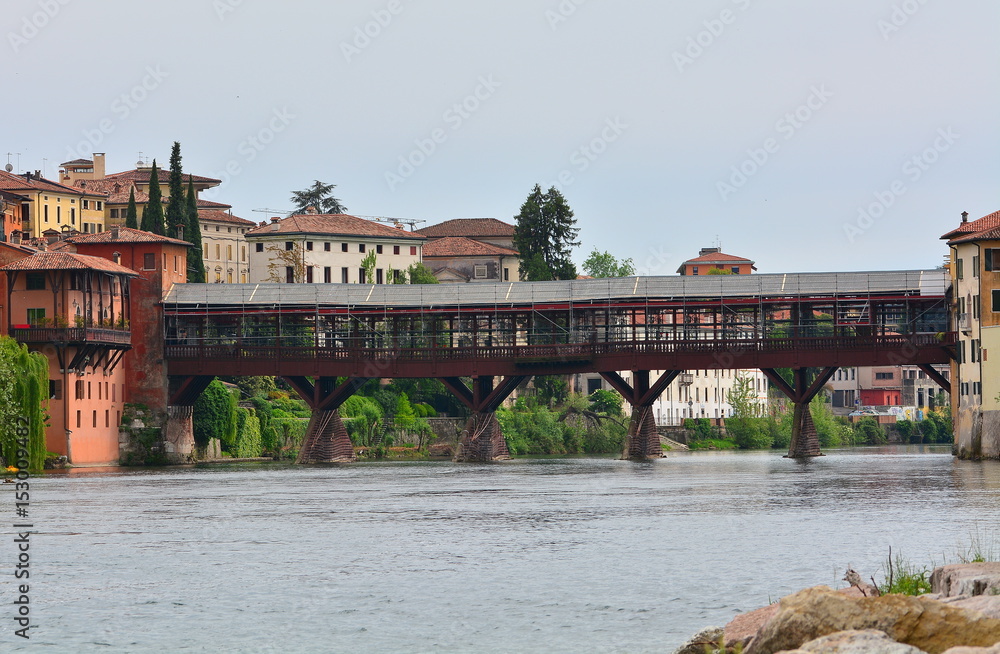 The historic wooden bridge in the town of Bassano in Italy on the river Brenta.