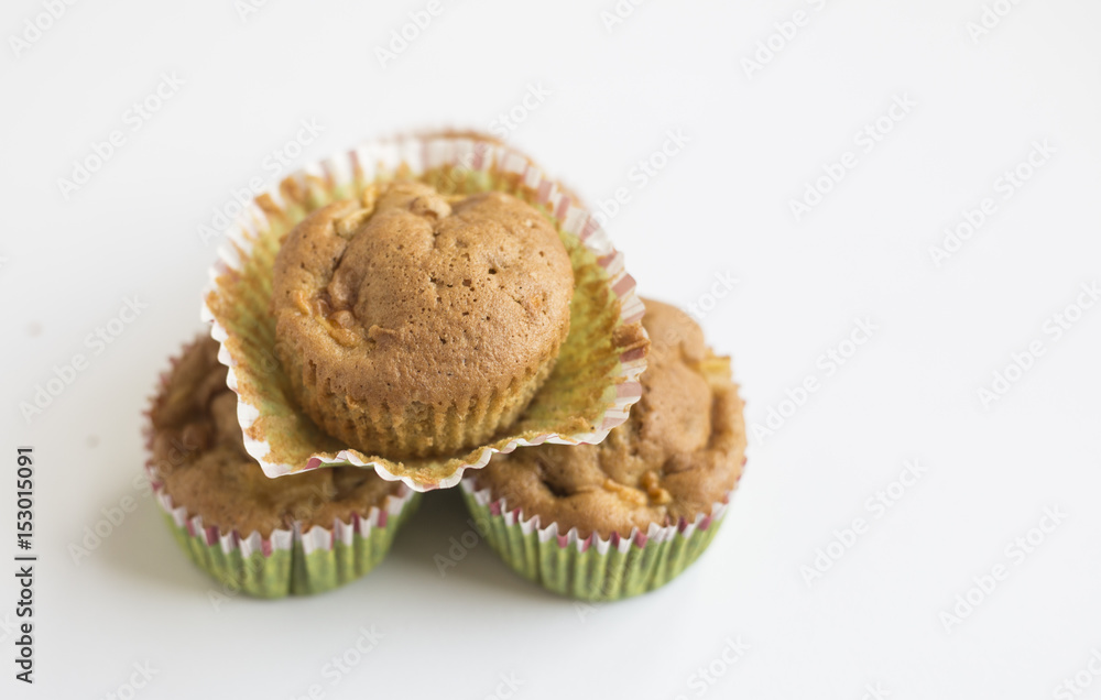 wholegrain muffins with apples on a dark wood background. tinting. selective focus