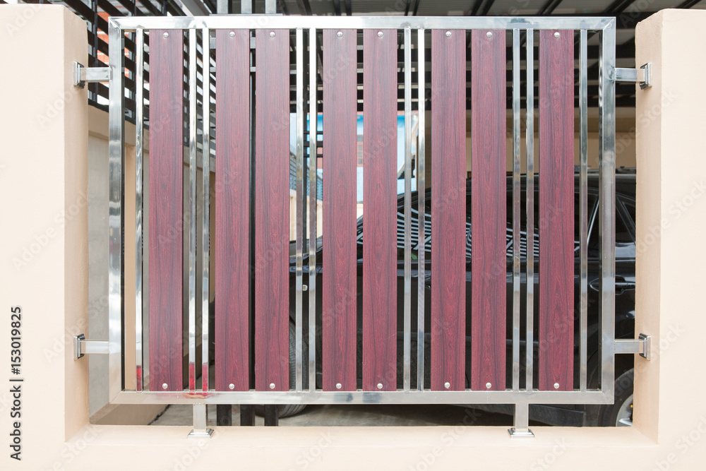 Wrought stainless steel and wood fence Wrought stainless steel and wood fence