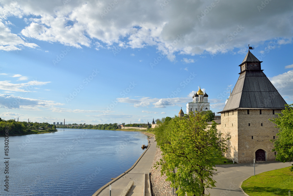 View of Trinity Cathedral, fortress tower with Olginsky bridge over the river Great