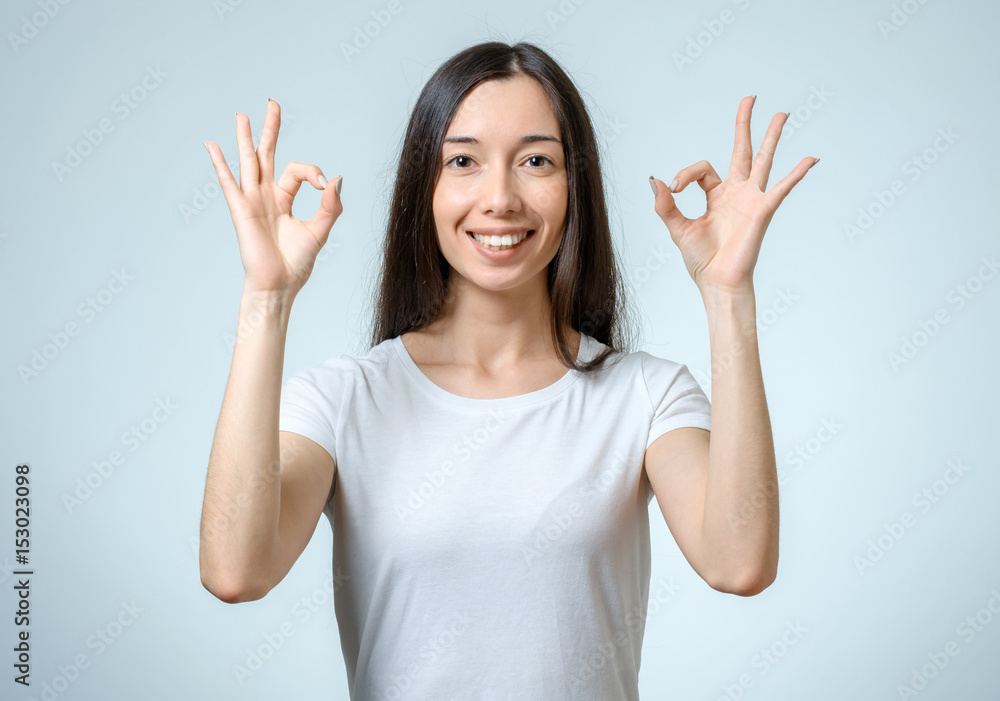 Success woman showing thumbs up gesture Success woman showing thumbs up gesture